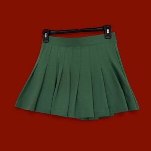 GREEN PLEATED MINI SKIRT PINK VS